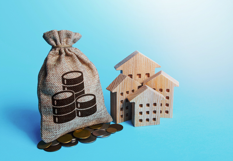 Houses and coin money bag. Real estate investment and rental business. Fair market price. Increasing property value. Home taxation. Residential or commercial property income. Municipal budget.